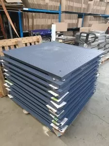 Finished floor pallet scales stacked in factory warehouse ready for shipment